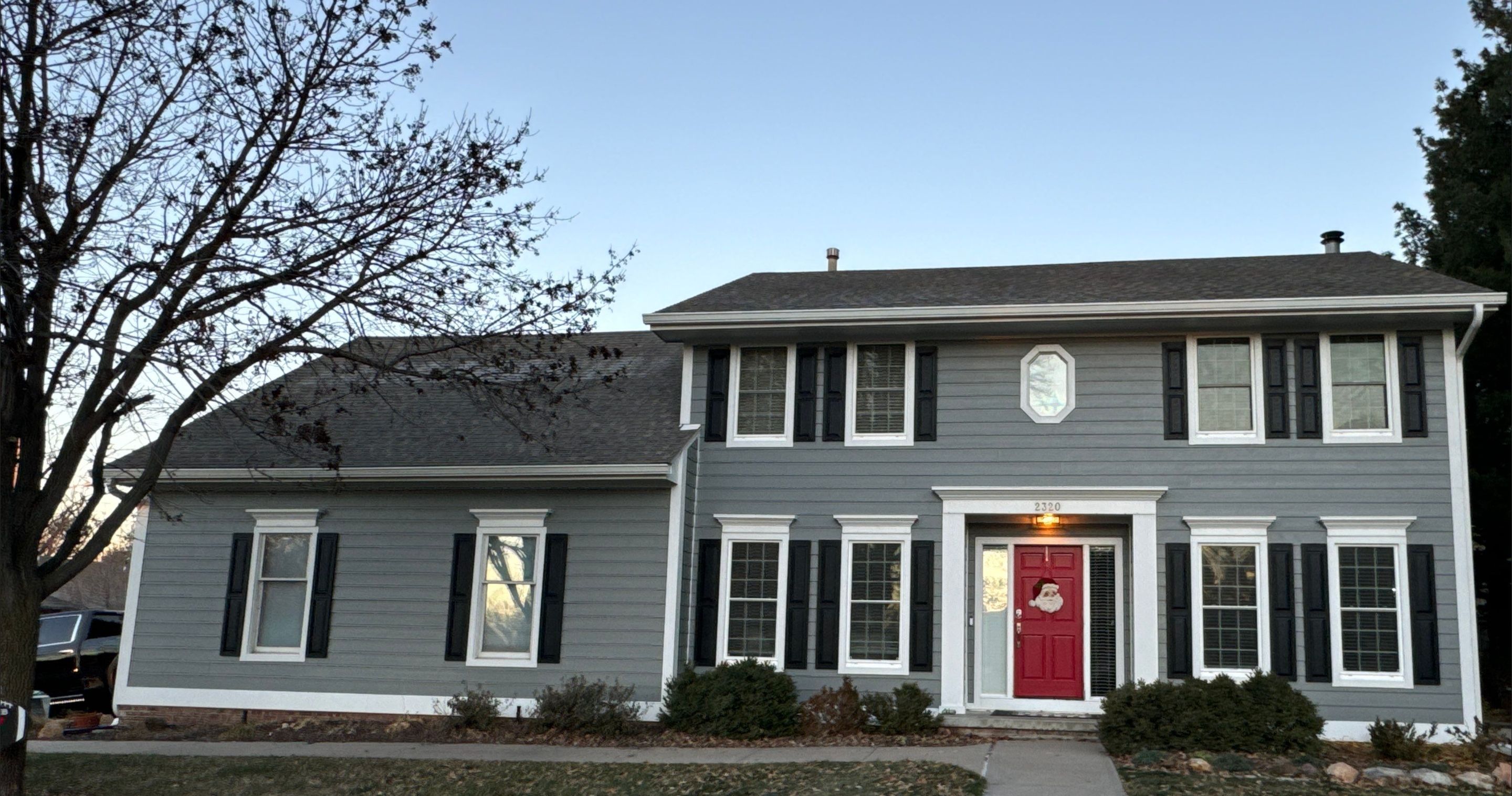 The home rendered in new siding and trim